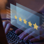 Person typing on a laptop with an overlay of five golden stars symbolizing a positive online review or customer feedback.